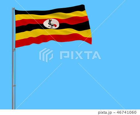 Isolate flag of Uganda on a flagpole fluttering. 46741060