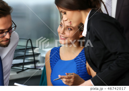 Group of modern businesspeople in office Group of modern businesspeople in office 46742017