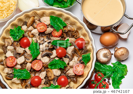 shortbread dough for baking quiche tart and filling in baking form shortbread dough for baking quiche tart and filling in baking form 46742107