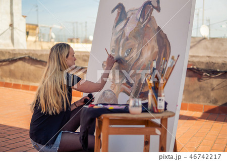 Young woman paint artist drawing at home roof 46742217
