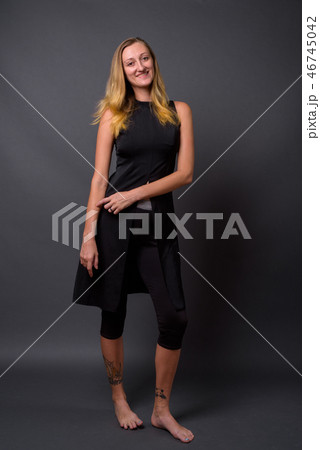 Full length portrait of young beautiful woman standing 46745042