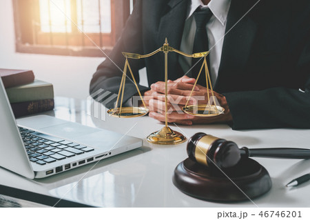 Male lawyer in the office with brass scale Male lawyer in the office with brass scale 46746201