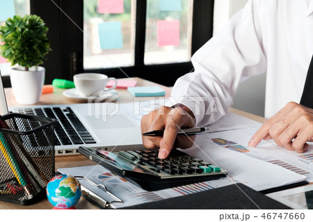 Businessman hand working with financial data Businessman hand working with financial data 46747660