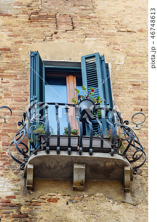 Window and balcony with wooden shutters Window and balcony with wooden shutters 46748613