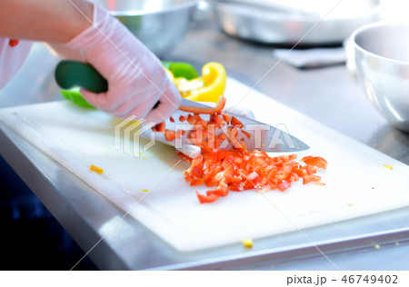 Chef cooking food in the kitchen 46749402