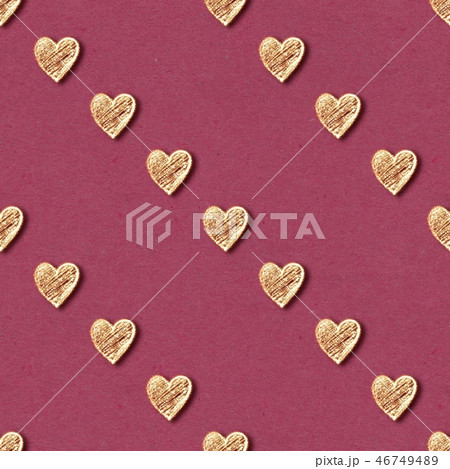 Golden hearts seamless pattern on red background 46749489
