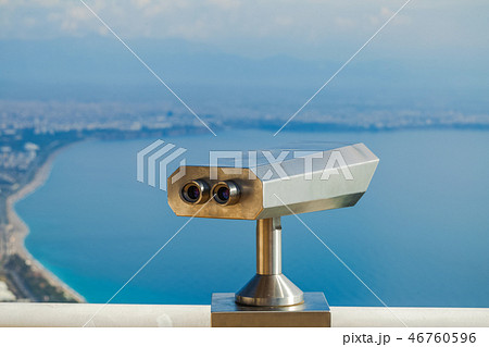 Closeup view of coin operated binocular viewer for looking Closeup view of coin operated binocular viewer for looking 46760596