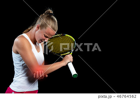 tennis woman player with injury holding the racket on a tennis court 46764562