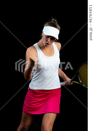 Beautiful girl tennis player with a racket on dark background wiht lights celebrating flawless 46764851