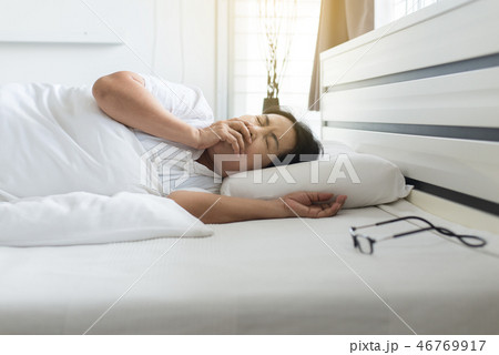 Elderly asian woman coughing and laying down 46769917