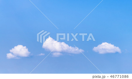 Blue sky with small white clouds. 46771086