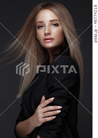 Beautiful woman with evening make-up and long straight hair . Smoky eyes. Fashion photo. 46774218