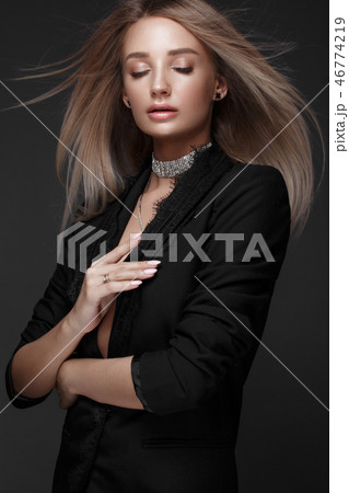 Beautiful woman with evening make-up and long straight hair . Smoky eyes. Fashion photo. 46774219