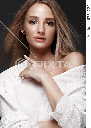 Beautiful woman with evening make-up and long straight hair . Smoky eyes. Fashion photo. 46774220