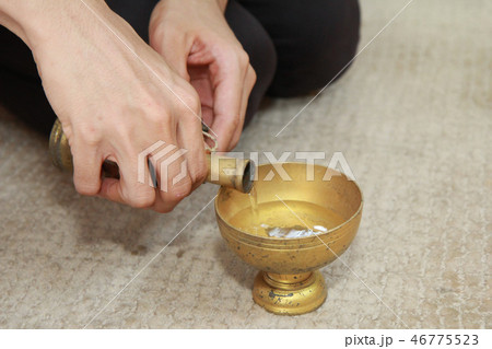 Pouring water from bottle into cup for share good Pouring water from bottle into cup for share good 46775523