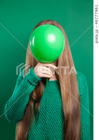 The girl covered her face with a balloon The girl covered her face with a balloon 46777961