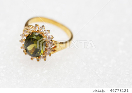 Beautiful gold ring with green gemstone Beautiful gold ring with green gemstone 46778121