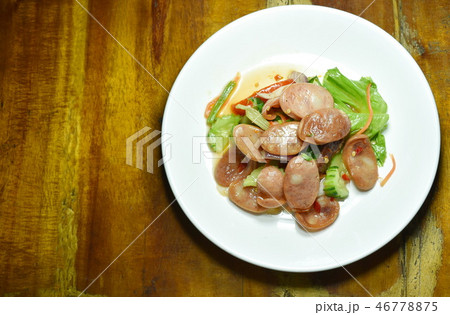spicy Chinese pork sausage with vegetable salad 46778875