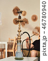 Man smoking hookah 46780940