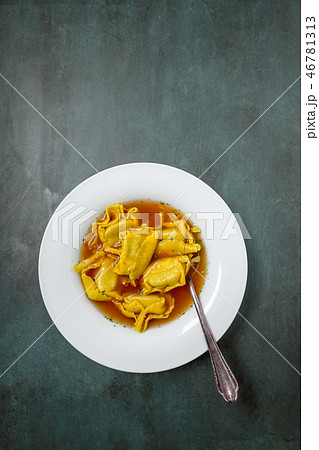 Homemade tortellini in broth in a top view Homemade tortellini in broth in a top view 46781313