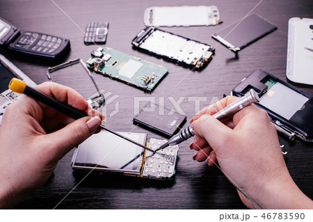 mobile phone repair, hands closeup 46783590