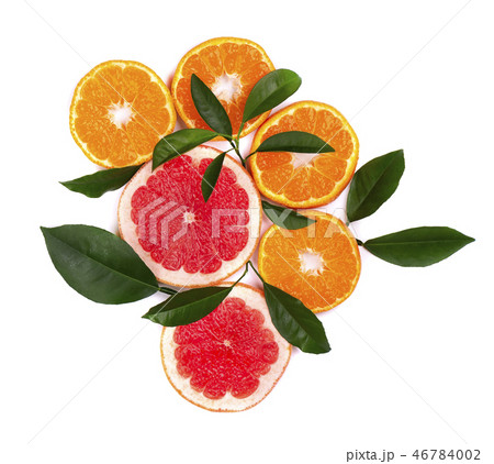 Citrus fruits isolated on white background. Isolated citrus fruits. Pieces of mandarin, pink Citrus fruits isolated on white background. Isolated citrus fruits. Pieces of mandarin, pink 46784002