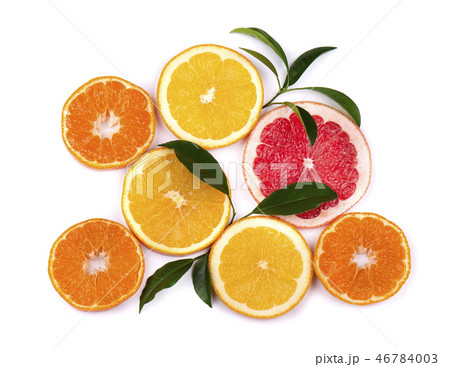 Citrus fruits isolated on white background. Isolated citrus fruits. Pieces of mandarin, pink Citrus fruits isolated on white background. Isolated citrus fruits. Pieces of mandarin, pink 46784003