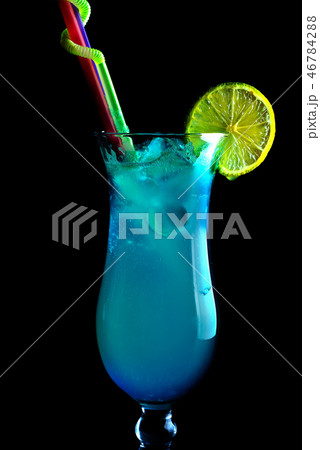 Alcoholic blue cocktails on a black background, in a tall glass 46784288