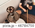 Man smoking hookah 46784750