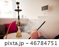 Man smoking hookah 46784751