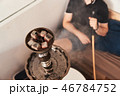 Man smoking hookah 46784752