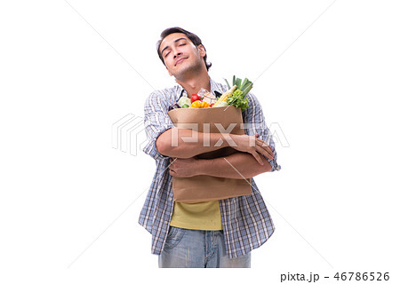 Young man with his grocery shopping on white 46786526