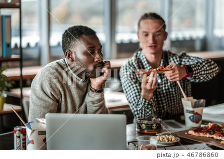 Thoughtful bearded male person touching his chin 46786860