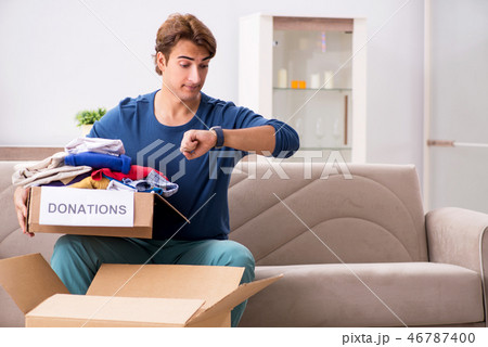 Concept of charity with donated clothing 46787400