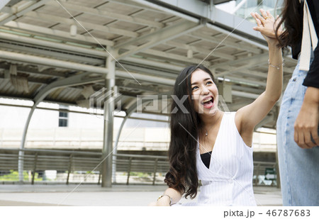 Beautiful woman very happy with friends on street. Beautiful woman very happy with friends on street. 46787683