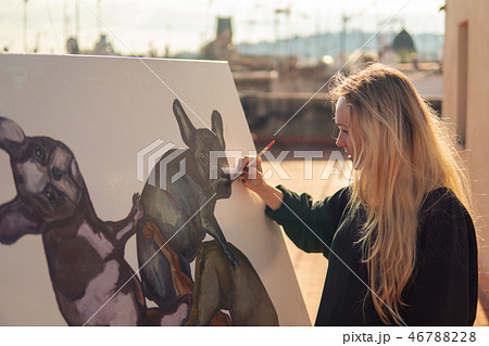 Young woman paint artist drawing at home roof 46788228