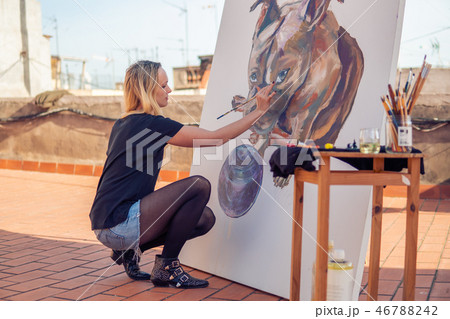Young woman paint artist drawing at home roof 46788242