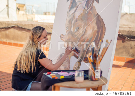 Young woman paint artist drawing at home roof 46788261