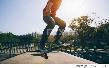 Skateboarder skateboarding at skatepark 46789551