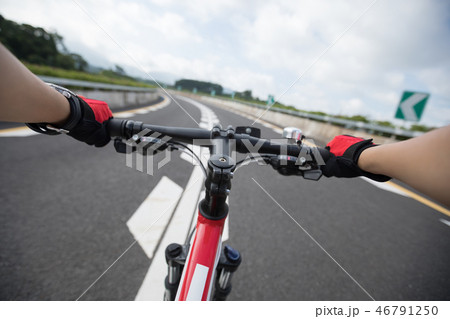Cyclist riding Mountain Bike on highway 46791250