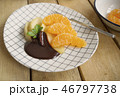 poached apples & fresh orange with chocolate sauce 46797738