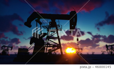 Pump jack industrial machine for petroleum in the sunrise. Silhouette of a pump jack pumping oil Pump jack industrial machine for petroleum in the sunrise. Silhouette of a pump jack pumping oil 46800145