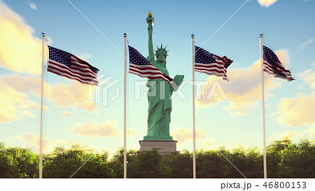 The American flags flutters in the wind on a sunrise against the blue sky and the Statue of Liberty The American flags flutters in the wind on a sunrise against the blue sky and the Statue of Liberty 46800153