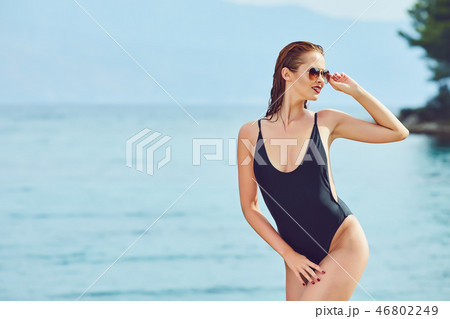 Beautiful woman on the beach. Summer holiday Beautiful woman on the beach. Summer holiday 46802249