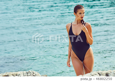 Beautiful woman on the beach. Summer holiday Beautiful woman on the beach. Summer holiday 46802250