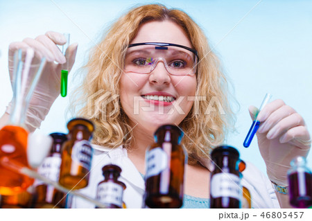 female chemistry student with glassware test flask. female chemistry student with glassware test flask. 46805457