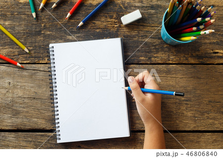 Girl hand drawing, blank paper and colorful pencil Girl hand drawing, blank paper and colorful pencil 46806840