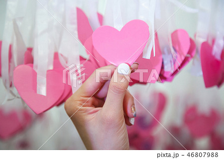 Woman Hand pick pink heart shape Lucky Draw Woman Hand pick pink heart shape Lucky Draw 46807988