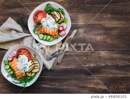 Grilled salmon with vegetables and quinoa 46808103