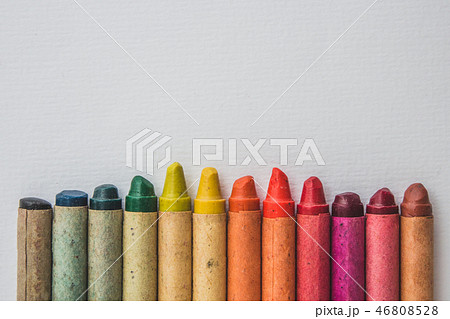 multi-colored  wax crayons on white paper -  - 46808528